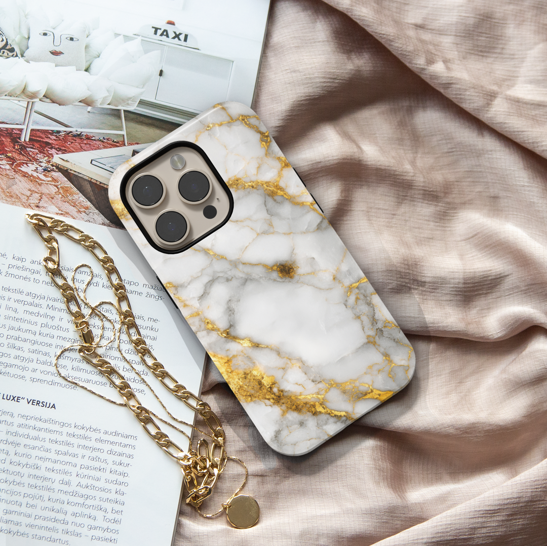 Elegant white marble iPhone case with gold vein accents – luxury stone design cover compatible with iPhone 16, 15, 14 Pro & Plus with MagSafe support.