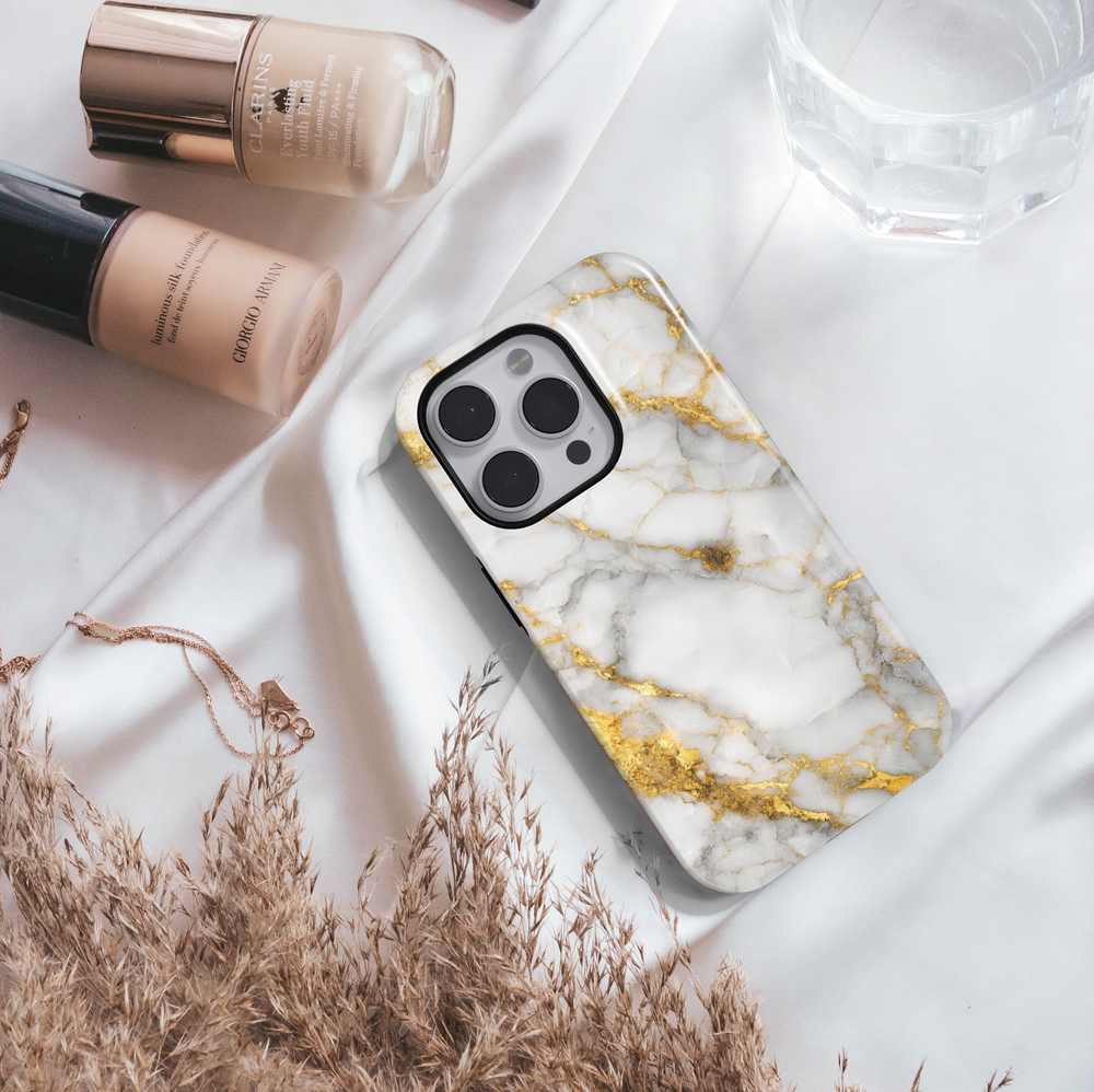 Elegant white marble iPhone case with gold vein accents – luxury stone design cover compatible with iPhone 16, 15, 14 Pro & Plus with MagSafe support.