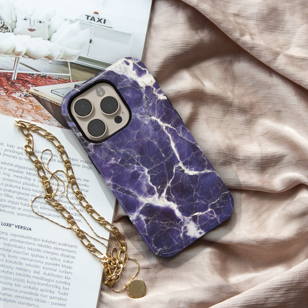 Dark purple marble iPhone 16 case with white cracked vein texture – premium gemstone-inspired design for iPhone models with MagSafe.