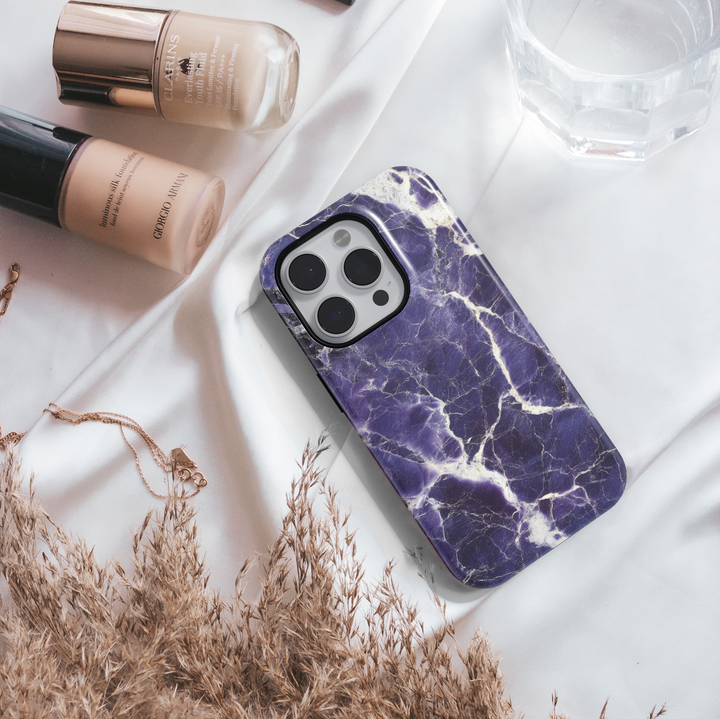 Dark purple marble iPhone 16 case with white cracked vein texture – premium gemstone-inspired design for iPhone models with MagSafe.
