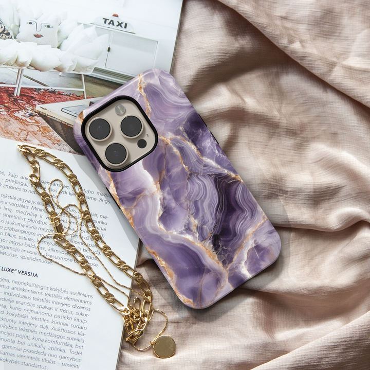 Purple marble iPhone 16 MagSafe case with white and gold veining – luxurious gemstone-inspired phone cover for iPhone models.