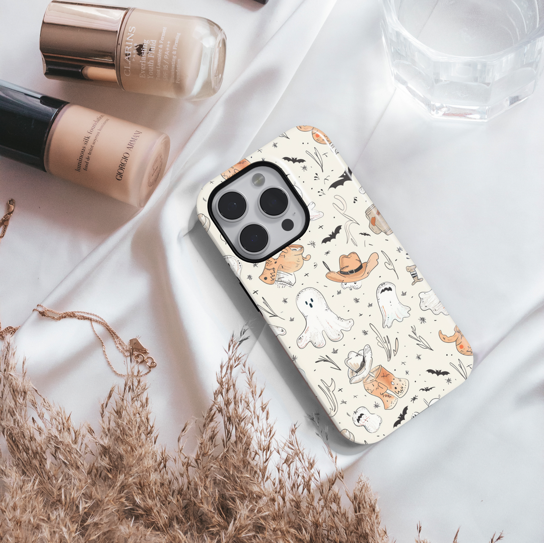 Halloween phone case with western cowboy ghost design, featuring cute ghosts in hats, boots, and bats on a cream background – protective iPhone and Samsung Galaxy cov