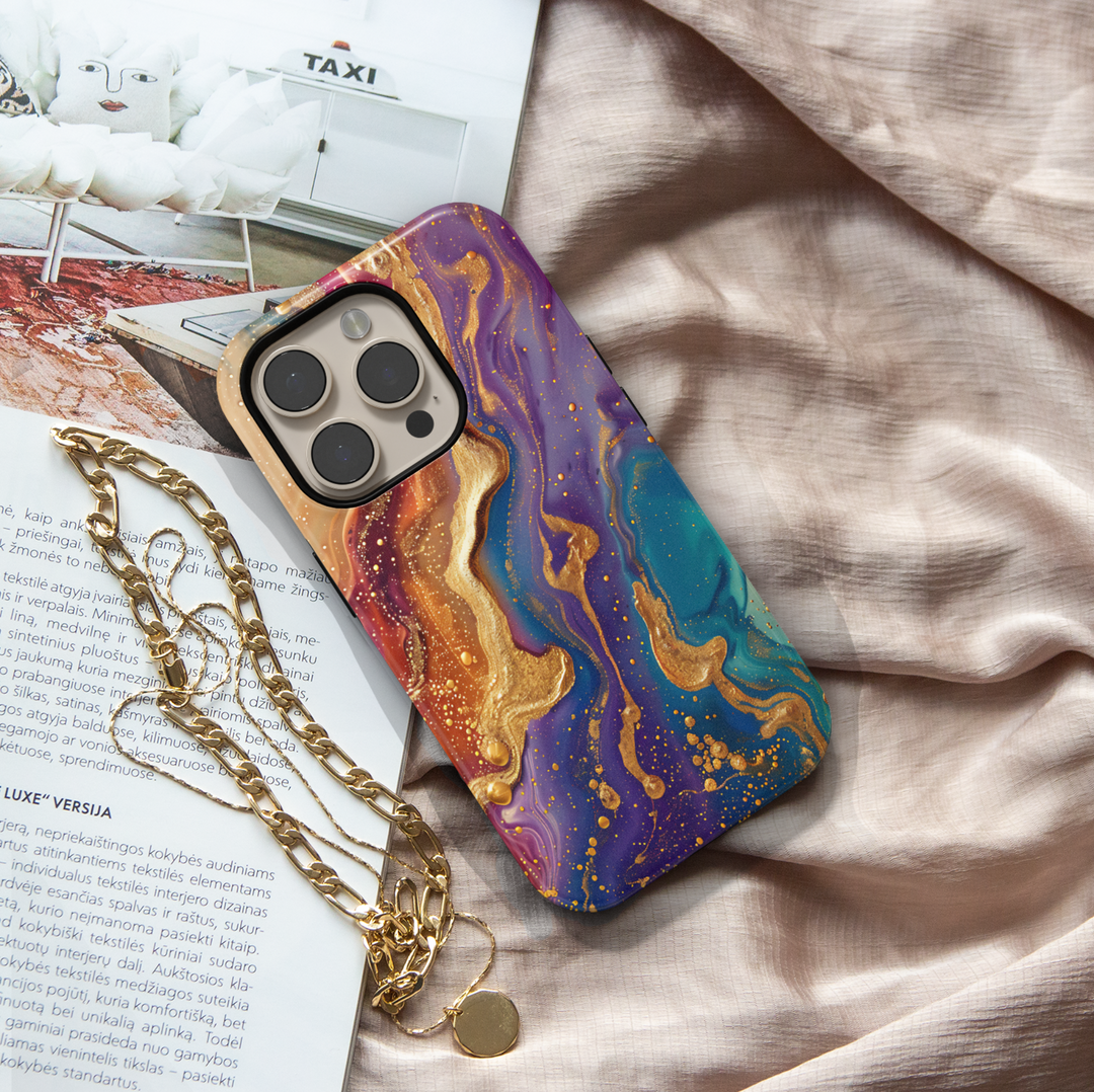 Tough iPhone 16 MagSafe case featuring vibrant purple, teal, and gold swirl design with a glossy finish.