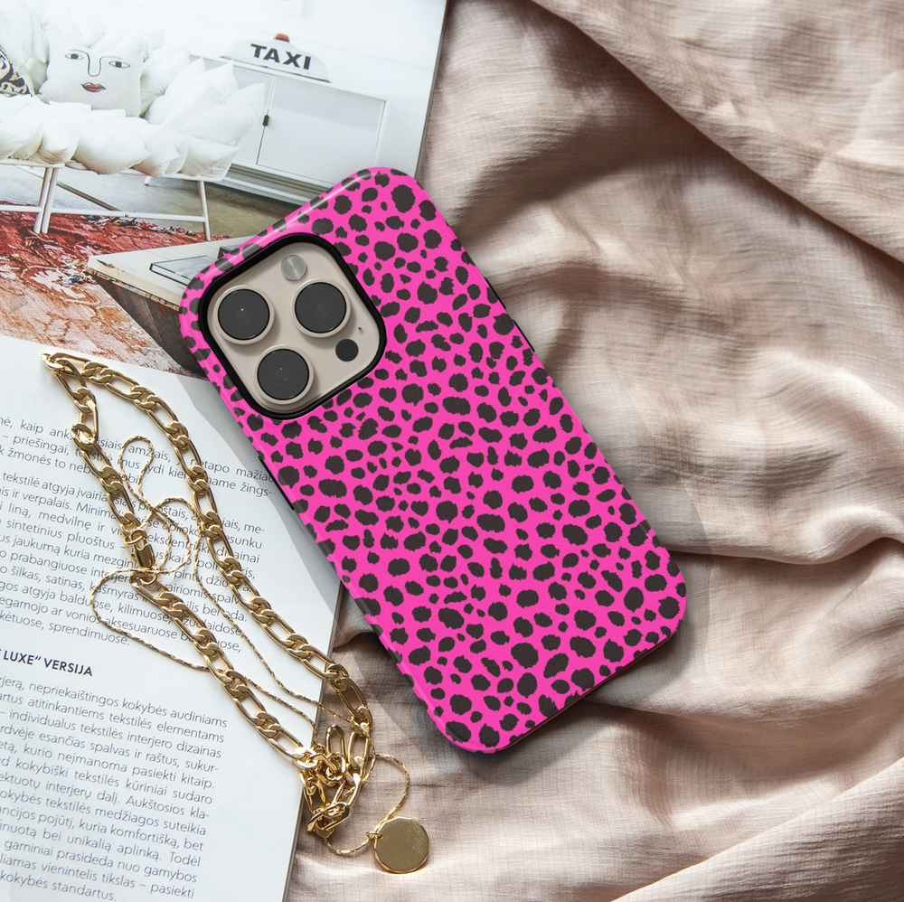 Hot pink leopard print iPhone case with bold black animal spots, designed for iPhone 16 series and MagSafe compatible, featuring a girly wild aesthetic.

