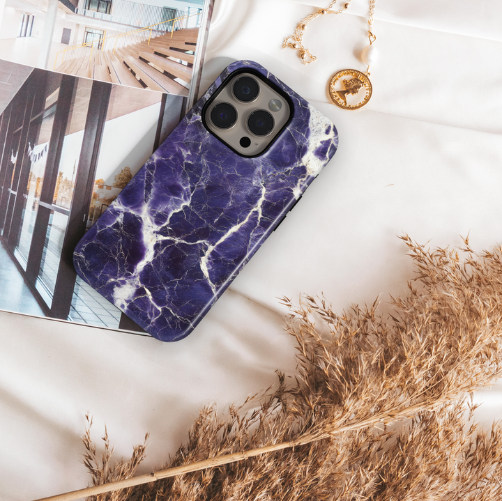 Dark purple marble iPhone 16 case with white cracked vein texture – premium gemstone-inspired design for iPhone models with MagSafe.