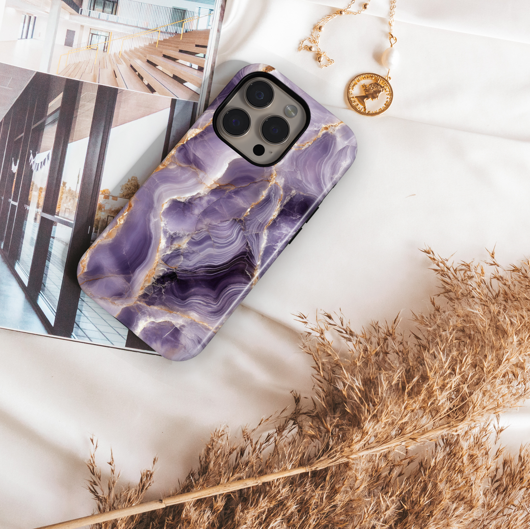 Purple marble iPhone 16 MagSafe case with white and gold veining – luxurious gemstone-inspired phone cover for iPhone models.