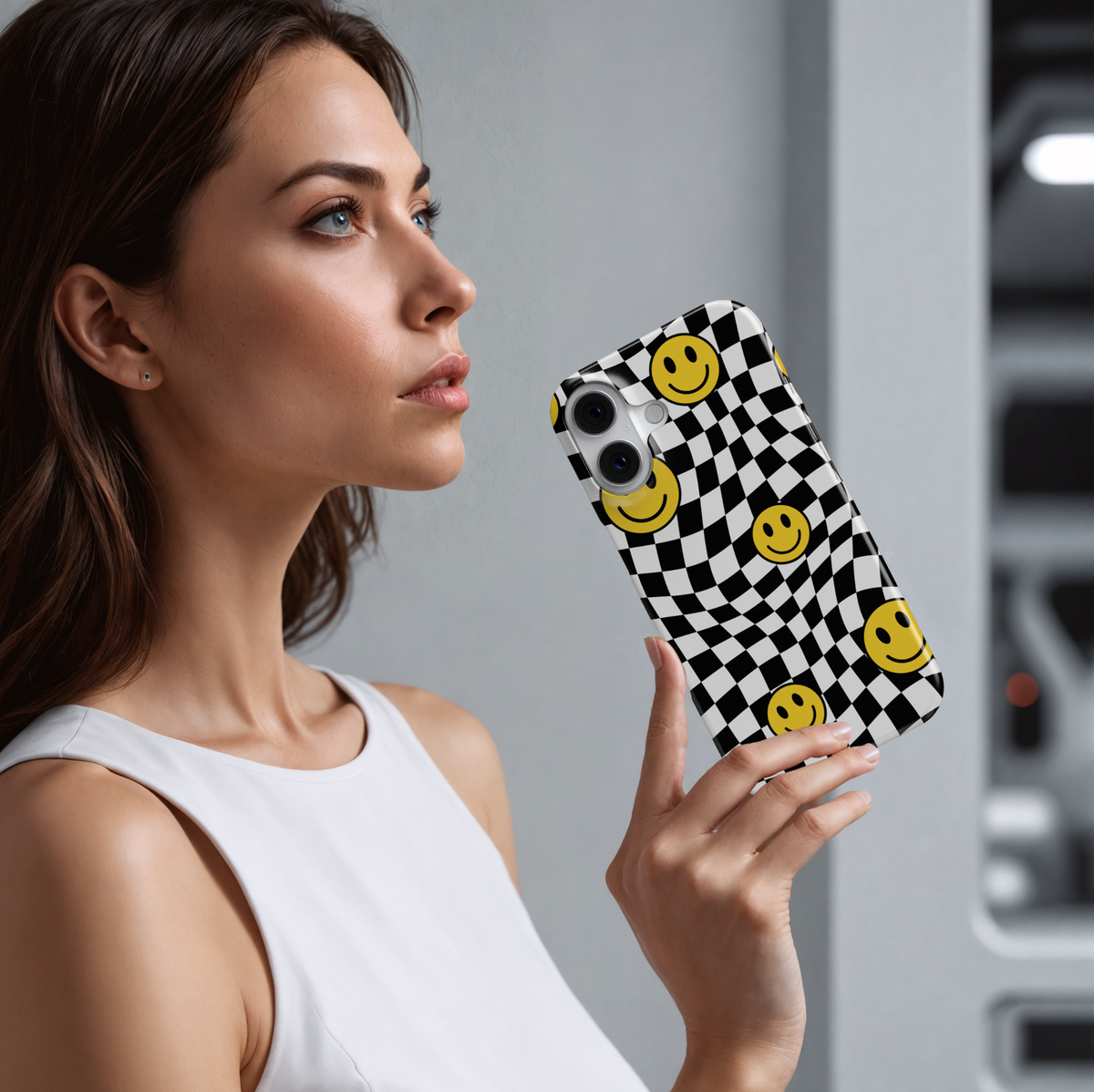 Trendy iPhone 16 case with warped black and white checkerboard pattern and yellow smiley face accents, MagSafe-compatible protective cover for women

