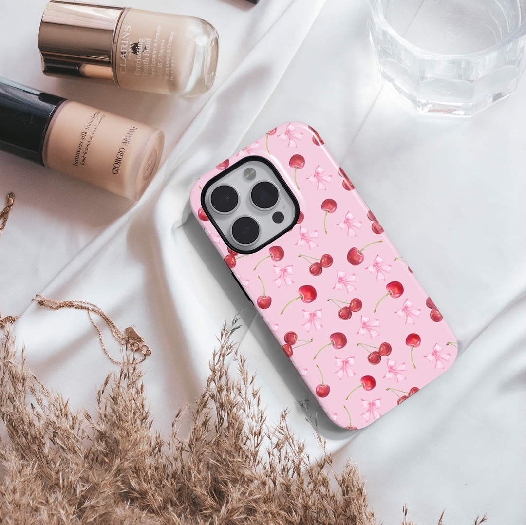 Girly pink iPhone case with black bow and star pattern – cute, aesthetic, and stylish protective phone cover for women and girls, compatible with iPhone models 14, 15, and 16.