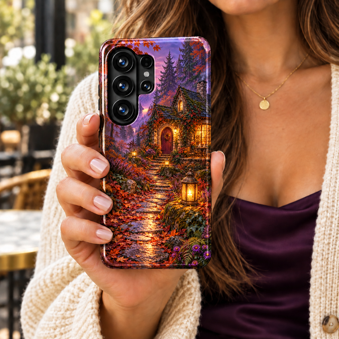The Last Lantern Samsung Galaxy case featuring a glowing stone cottage, lantern-lit path, orange autumn leaves and a misty purple forest.