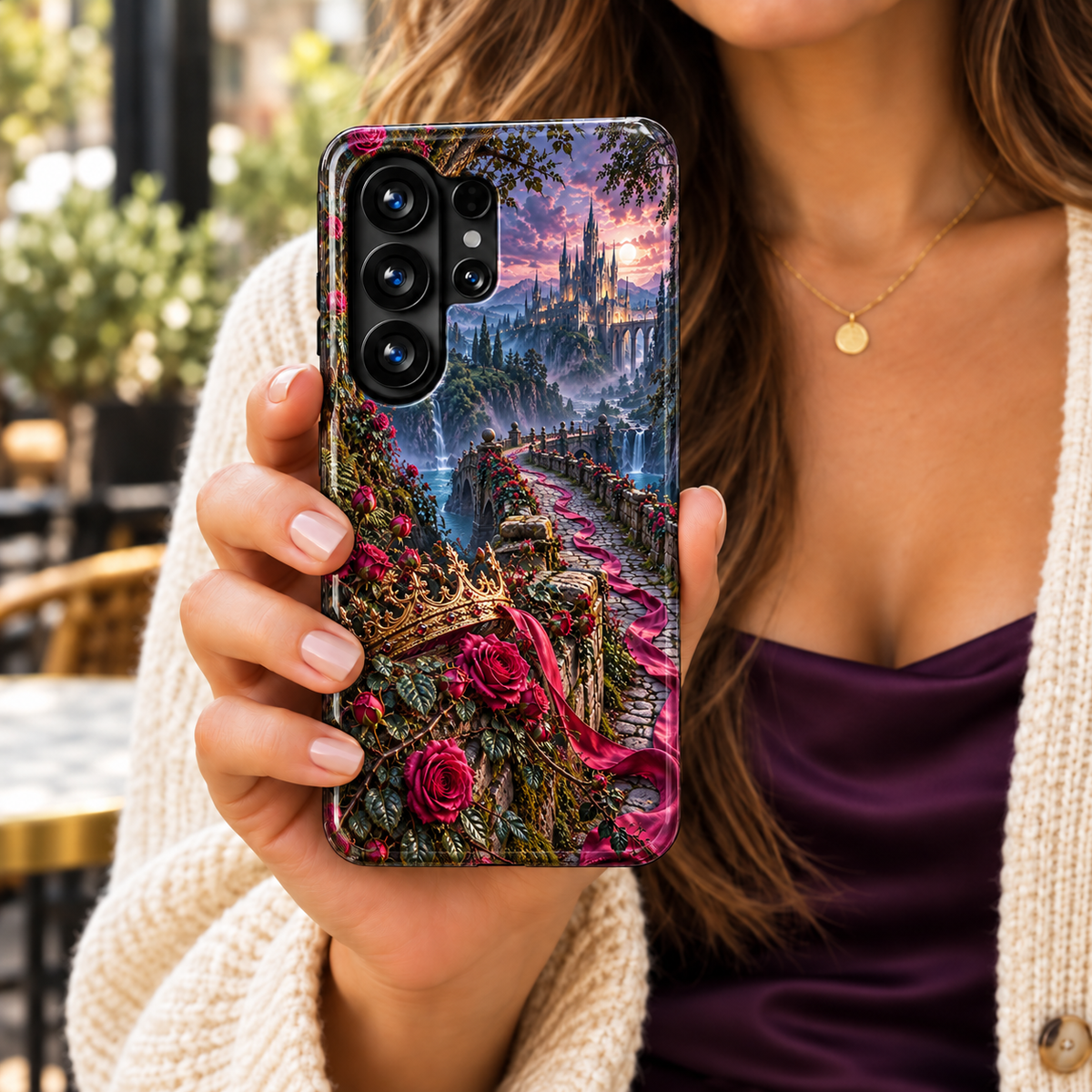 CASELIX Briarbound Samsung Galaxy case featuring a rose-covered stone bridge, flowing pink ribbon, gold crown and distant castle above waterfalls.