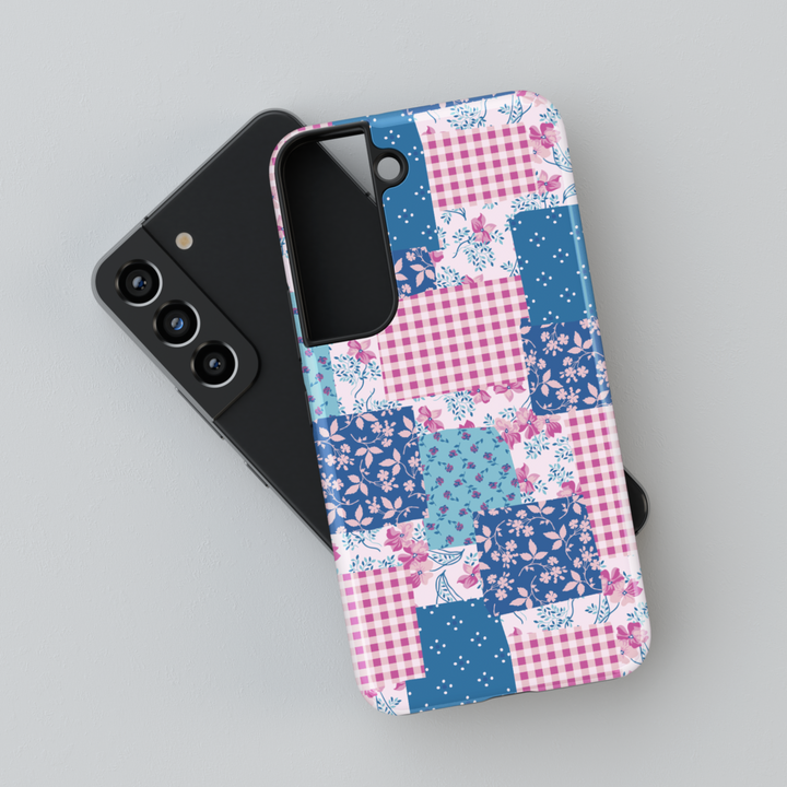 Charming patchwork Samsung Galaxy phone case featuring a vintage-inspired mix of floral, gingham, and polka dot patterns in blue and pink hues. Aesthetic protective cover for Samsung Galaxy S25 Ultra, S24 FE, S23, and more.