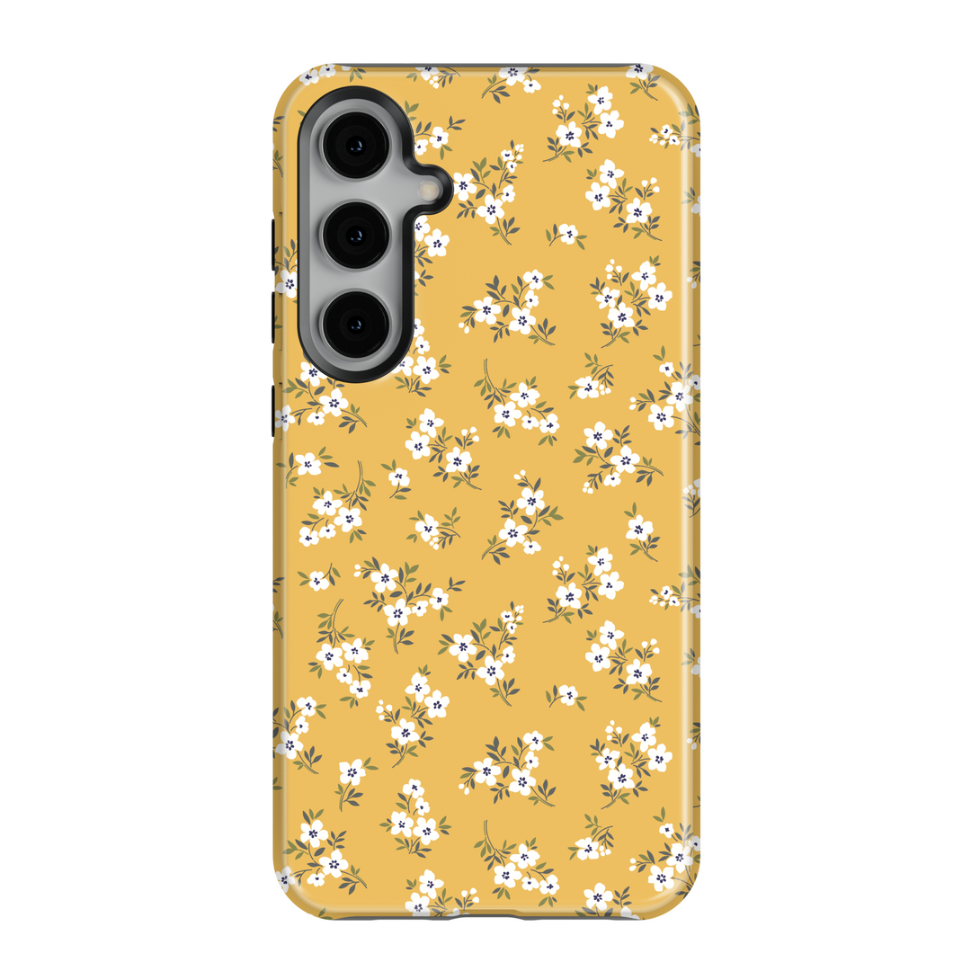 Add a pop of sunshine to your phone with this mustard yellow Galaxy case. Designed with petite white flowers and green leaves, it’s a fun and vibrant accessory for everyday style.