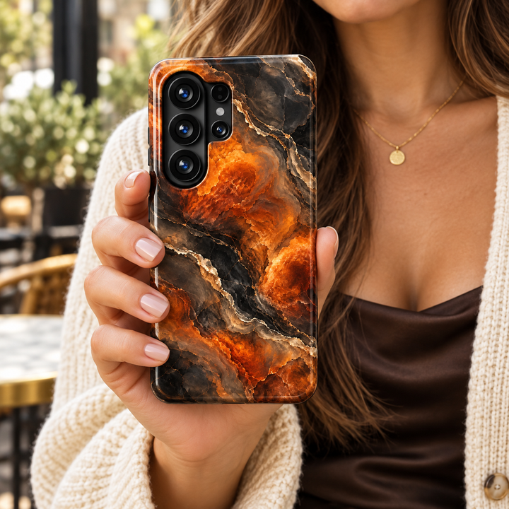 Ember Veil Samsung Galaxy case featuring burnt orange and amber marble swirls, smoky charcoal tones, and fine cream veins in a glossy finish.