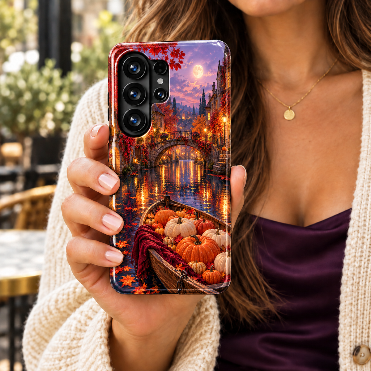 Maplemoon Canal Samsung Galaxy case featuring a pumpkin-filled wooden boat, burgundy blanket and moonlit stone bridge with golden reflections on the water.