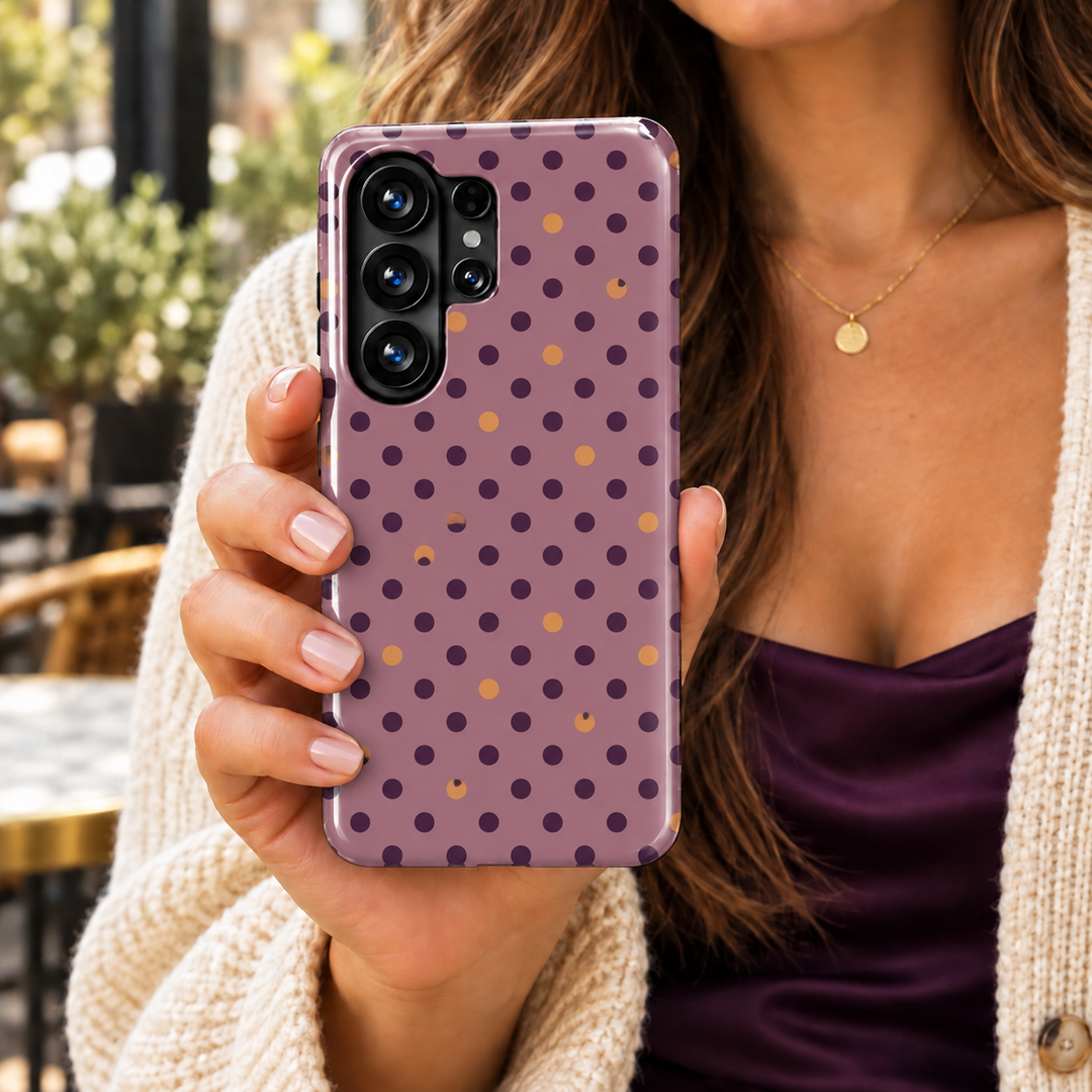Plum Seduction Samsung Galaxy case featuring small dark plum polka dots and copper accents on a dusty mauve background with a glossy finish.