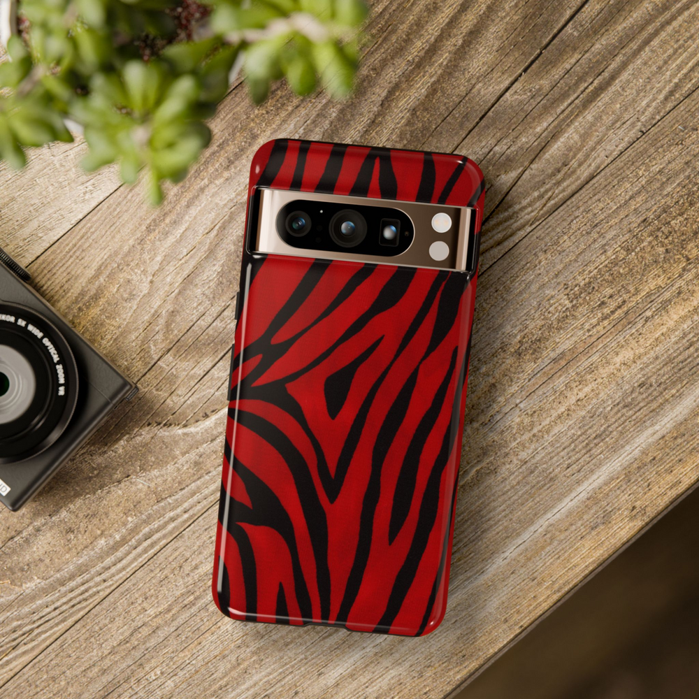 Google Pixel case with bold red and black zebra stripe pattern, fashion-forward animal print design

