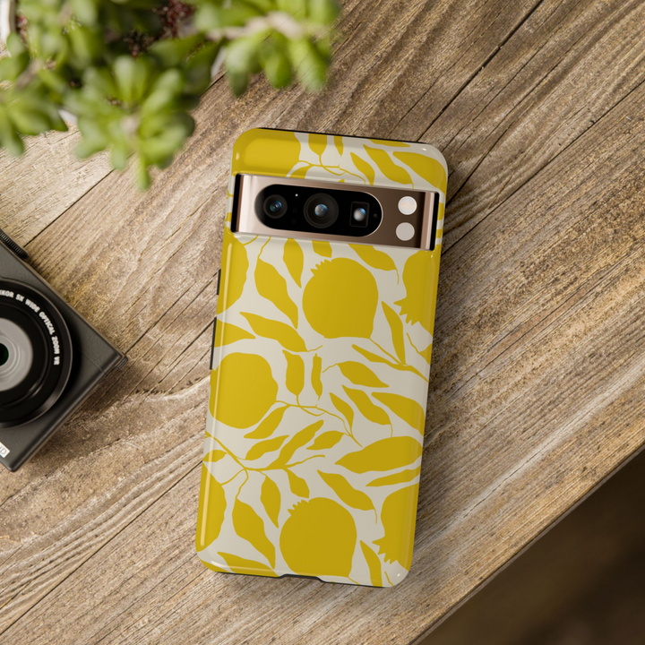 Google Pixel case with yellow fruit and leaf silhouettes on cream background, abstract botanical design

