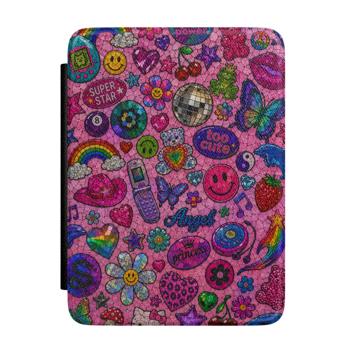 Pink Y2K Kindle case featuring colorful sticker-style graphics with a disco ball, flip phone, butterflies, smiley faces, hearts, cherries, flowers and rainbows.