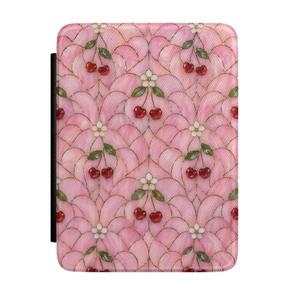 Pink Kindle case featuring red cherries, white blossoms, and a scalloped cottagecore pattern with elegant gold accents.