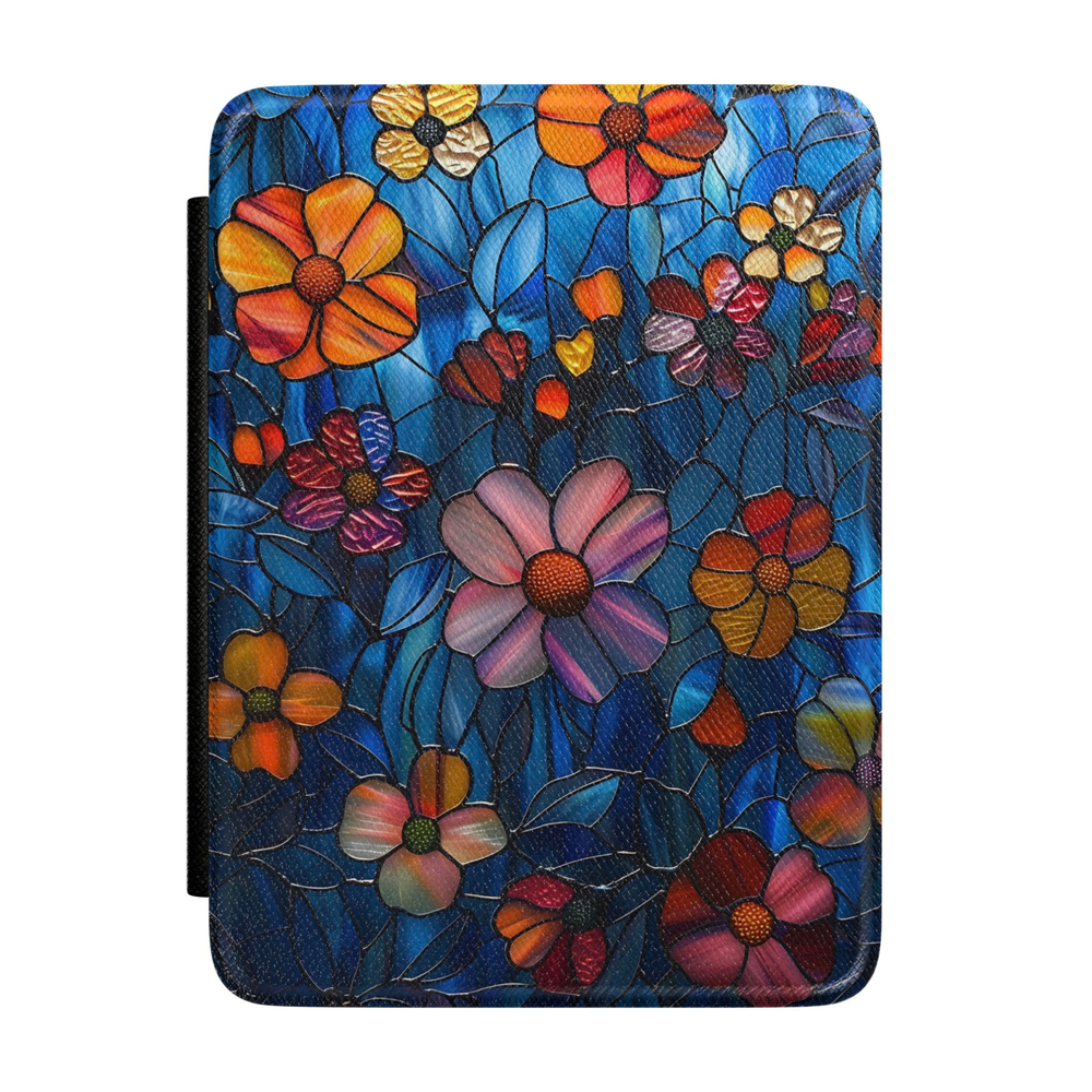 Kindle case featuring colorful stained glass flowers in pink, orange, gold, and purple on a deep blue background with intricate botanical details.