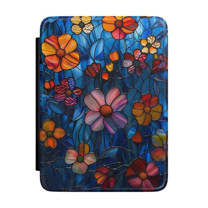 Kindle case featuring colorful stained glass flowers in pink, orange, gold, and purple on a deep blue background with intricate botanical details.