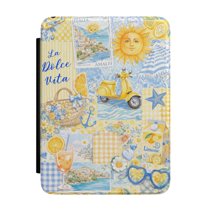 Italian-inspired Kindle case featuring Amalfi Coast scenery, lemons, yellow Vespa scooter, La Dolce Vita typography, citrus cocktails, blue gingham, flowers, and Mediterranean summer illustrations.