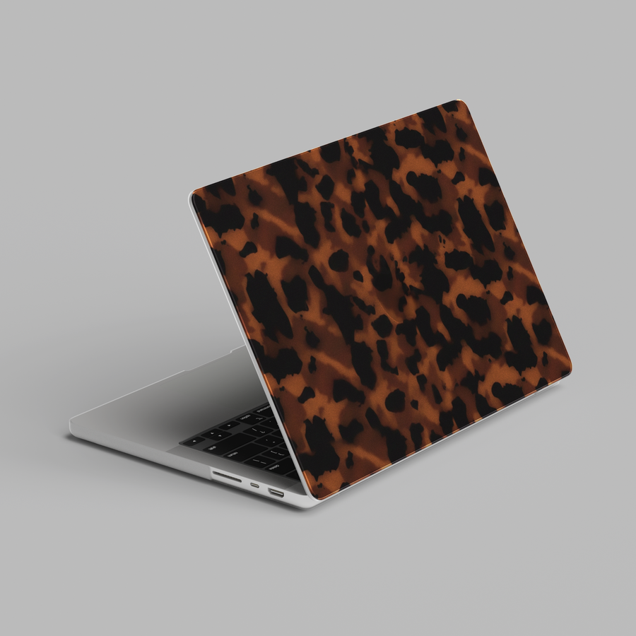 Leopard print MacBook cover with brown and black tortoiseshell pattern on slim protective laptop case