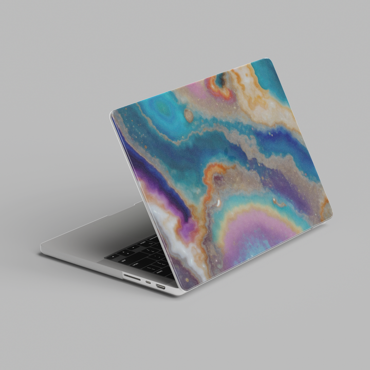 Pastel abstract marble MacBook case with teal, lavender, and peach tones accented by soft gold veining