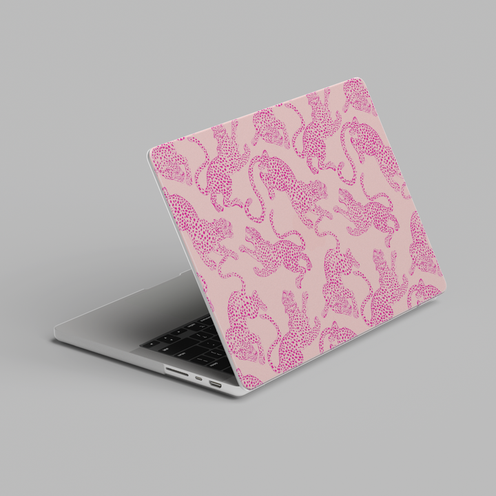 Pink leopard print MacBook case with repeating cheetah pattern in a cute aesthetic style