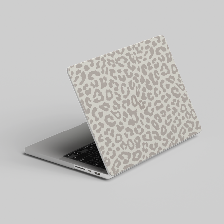 Beige cheetah print MacBook case with minimalist animal pattern, aesthetic laptop skin compatible with MacBook Pro and Air models.