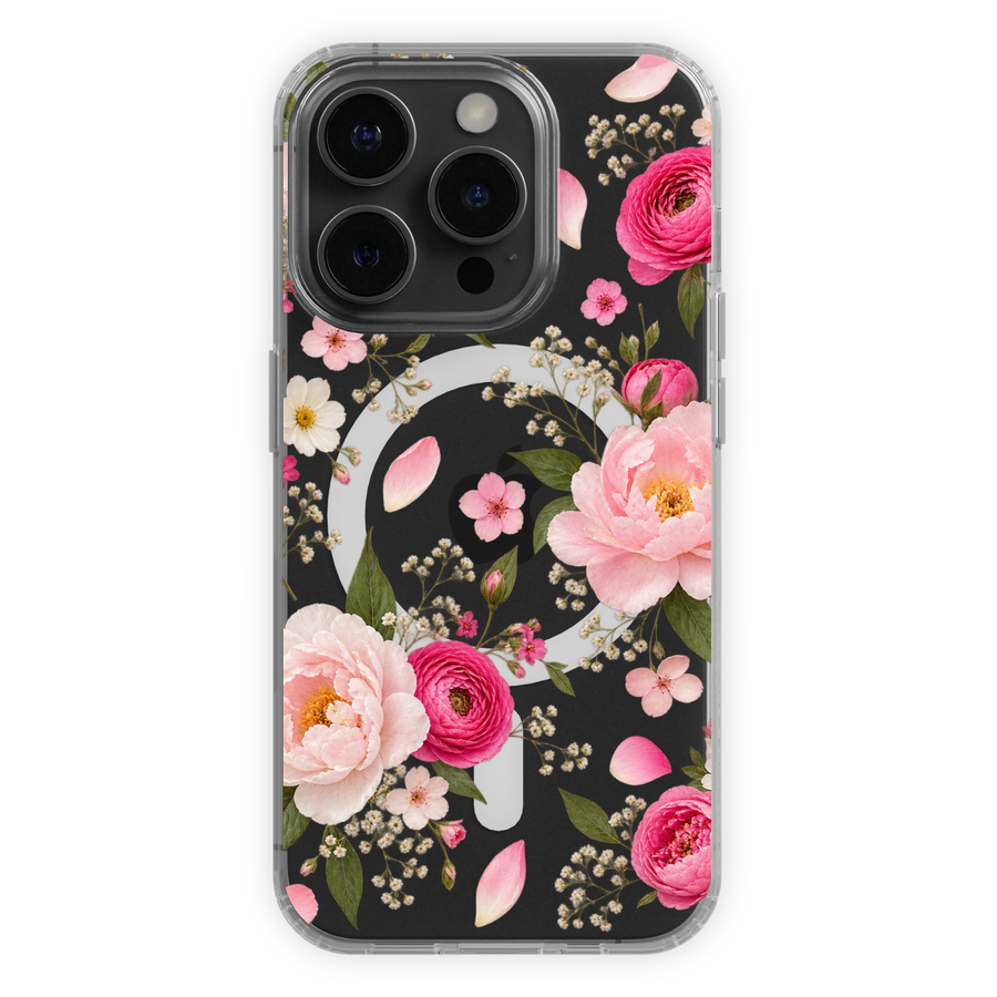 Clear MagSafe iPhone case featuring blush pink and hot pink peonies, delicate white flowers, green leaves and scattered petals.