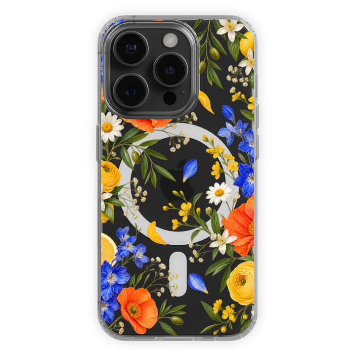 Clear MagSafe iPhone case with vibrant orange poppies, yellow flowers, blue wildflowers, citrus and green botanical leaves.