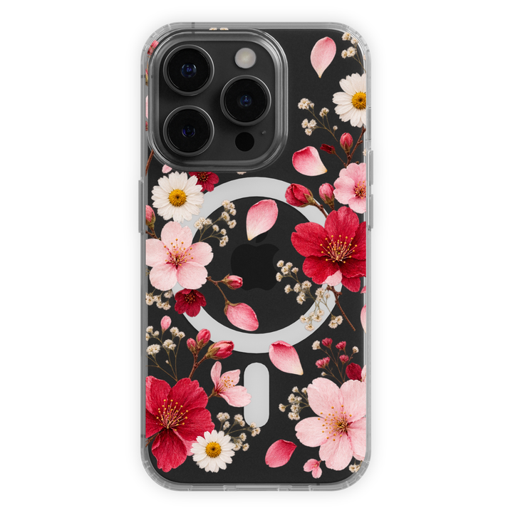 Clear MagSafe iPhone case with pink and red cherry blossoms, white daisies, baby’s breath and scattered flower petals.