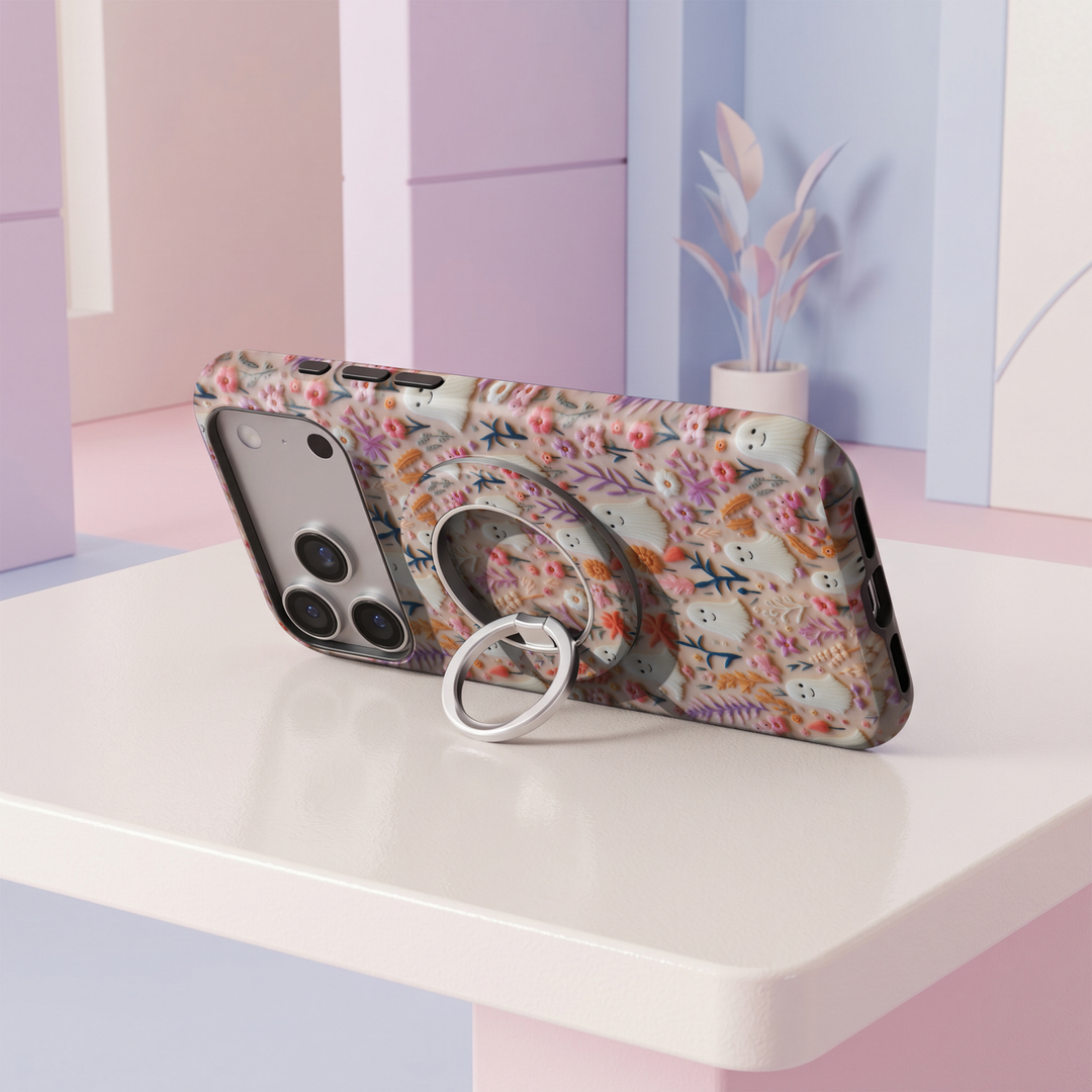 Sweet Little Ghosts MagSafe ring holder with cute white ghosts, pastel pink and orange flowers, botanical details and silver rotating magnetic phone grip.