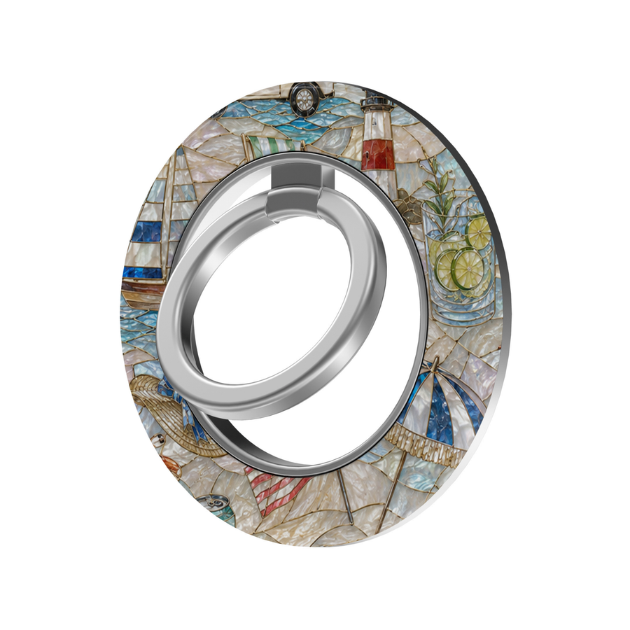 Coastal Escape MagSafe ring holder with pearl-inspired seaside design featuring sailboats, lighthouse, beach umbrella and ocean details with silver rotating magnetic phone grip.