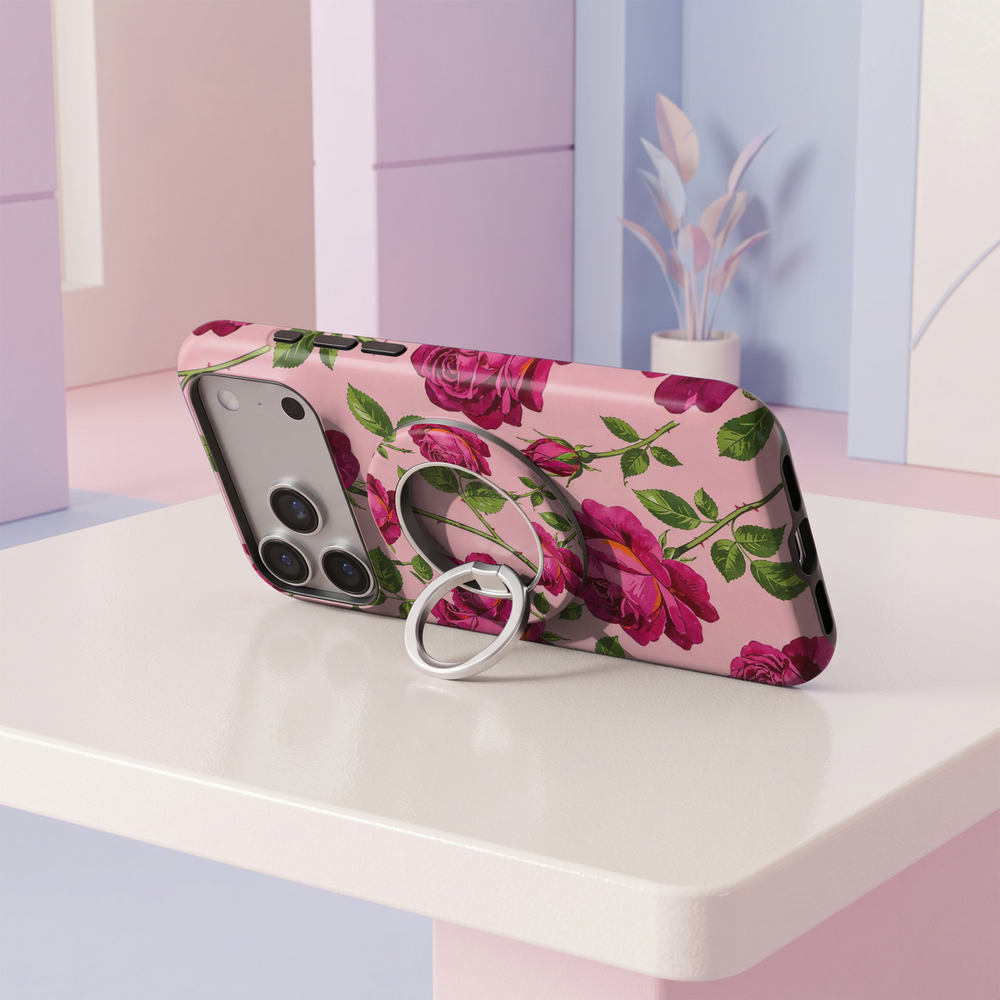 Fuchsia Rose Garden MagSafe ring holder with vibrant pink roses, green leaves, blush pink background and silver rotating magnetic phone grip.