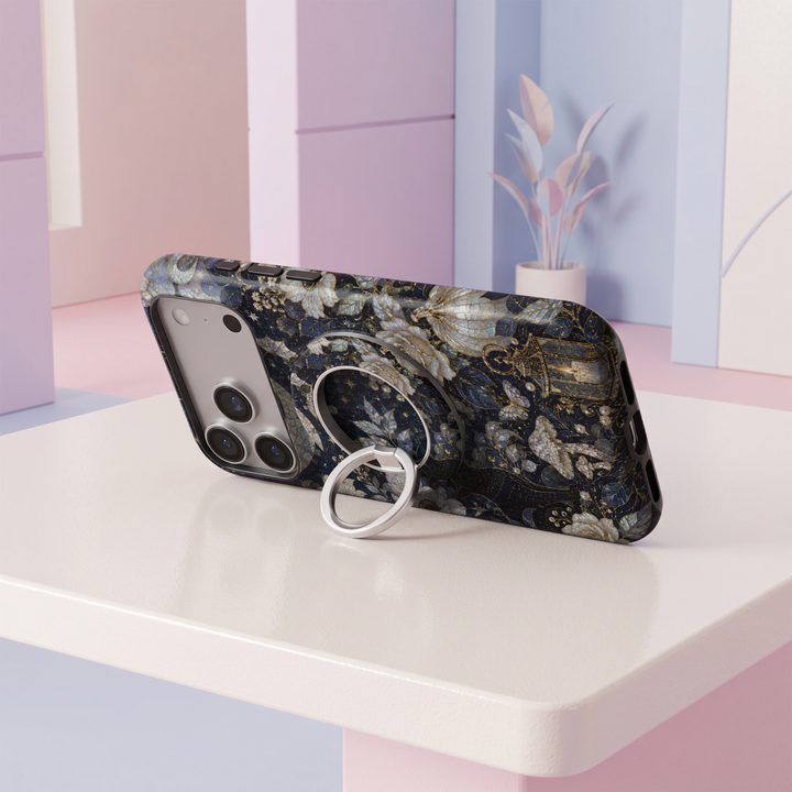 Midnight navy floral stained glass MagSafe ring holder with luminous ivory flowers, delicate gold accents and a sleek silver magnetic phone grip and stand.