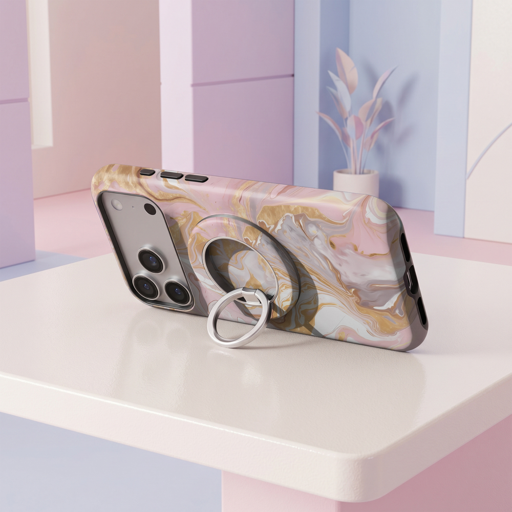 Blush pink and champagne gold marble MagSafe ring holder with soft ivory swirls and a sleek silver magnetic phone grip and stand.