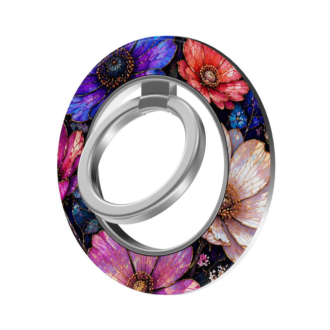 Midnight Bloom MagSafe Ring Holder featuring vibrant violet, blue, pink, coral and ivory florals on a dark midnight background with gold-inspired detailing and a silver magnetic phone ring grip and stand.