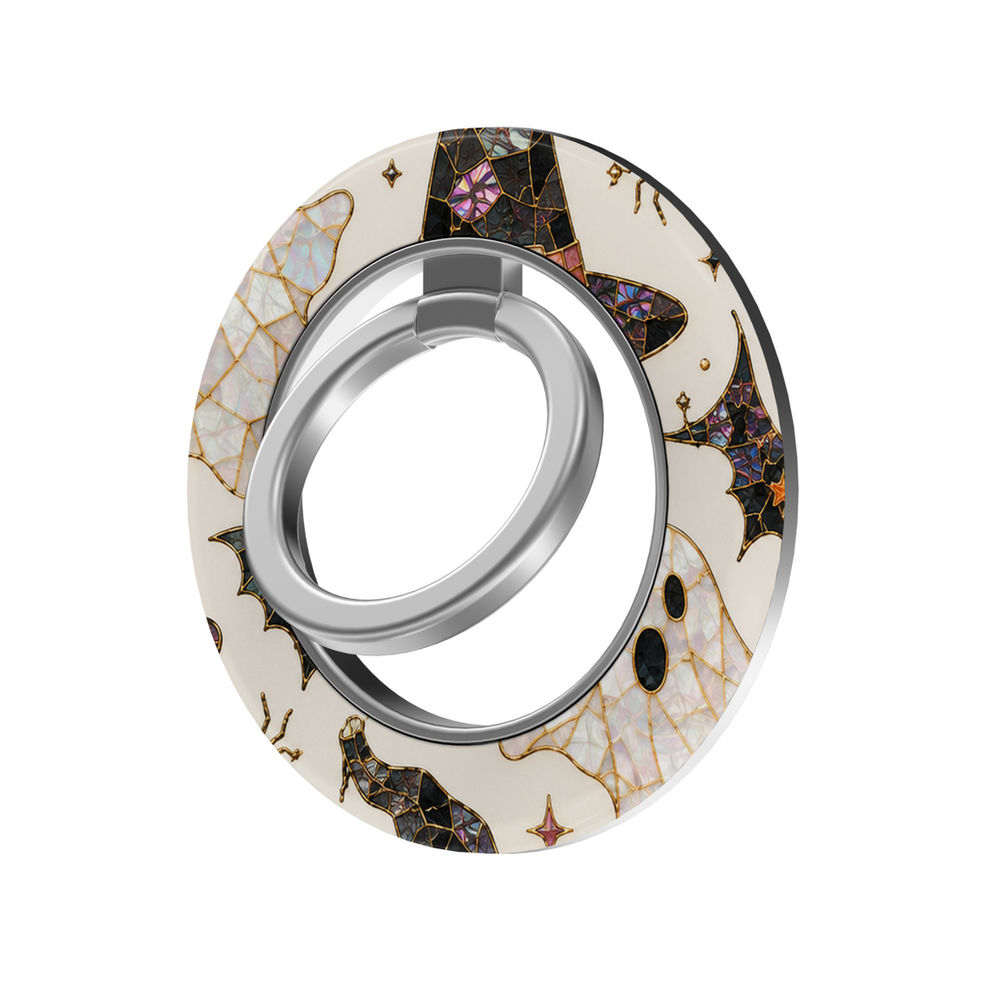 Halloween stained glass MagSafe ring holder featuring opal ghosts, black witch hats, bats, gold accents, and a silver magnetic phone grip and stand.