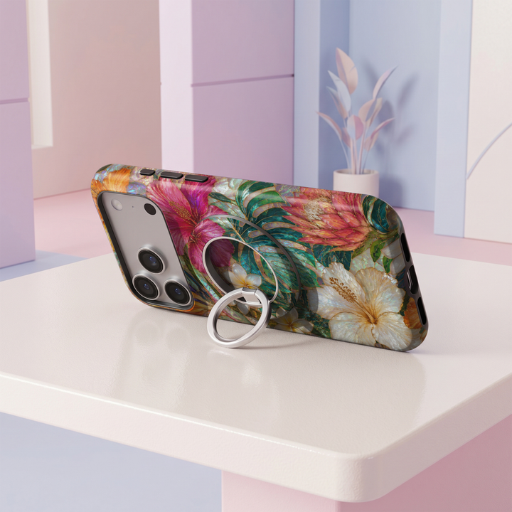 Emerald green and fuchsia floral stained glass MagSafe ring holder with iridescent details, gold accents, and a silver magnetic phone grip and stand.