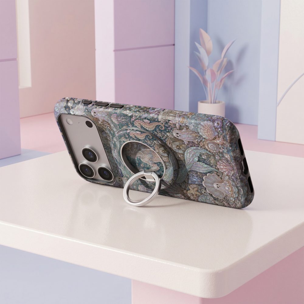 Mermaid Cove MagSafe ring holder featuring an iridescent ocean mosaic with seashells, pearls, seahorses and flowing aqua blue waves with a silver magnetic phone grip.