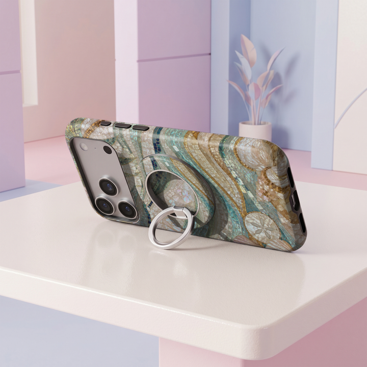 Coastal Mosaic MagSafe ring holder featuring flowing pearl, aqua, teal and navy mosaic tiles with subtle gold accents and a silver magnetic phone grip.