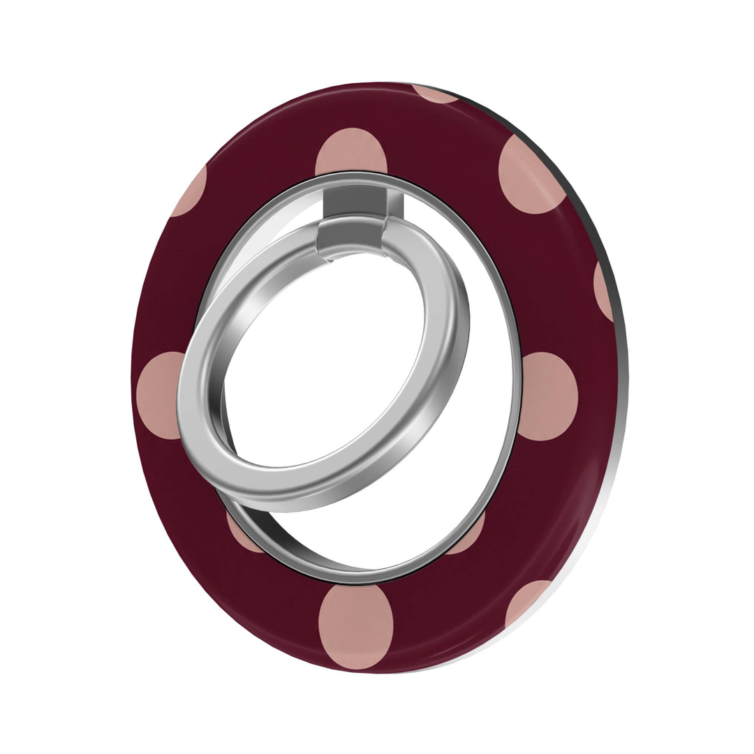 CASELIX Blush Dots MagSafe Ring Holder featuring soft blush pink polka dots on a deep burgundy background with a silver metal finger ring.