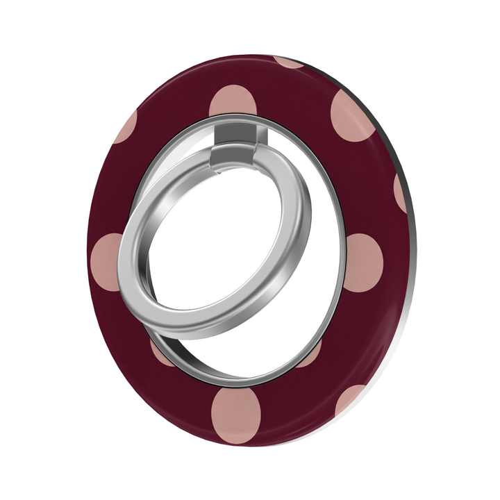 CASELIX Blush Dots MagSafe Ring Holder featuring soft blush pink polka dots on a deep burgundy background with a silver metal finger ring.