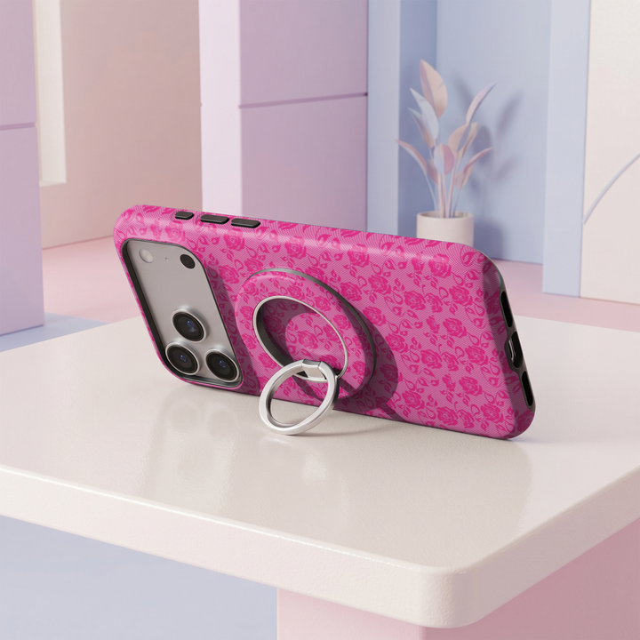 Hot pink floral rose lace pattern MagSafe ring holder with a silver magnetic phone grip and stand.