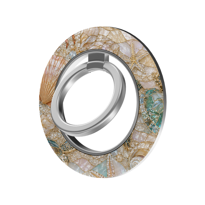 Coastal Treasures MagSafe ring holder featuring pearl seashells, starfish and turquoise sea turtles with elegant gold accents on an iridescent coastal background and silver magnetic phone grip.