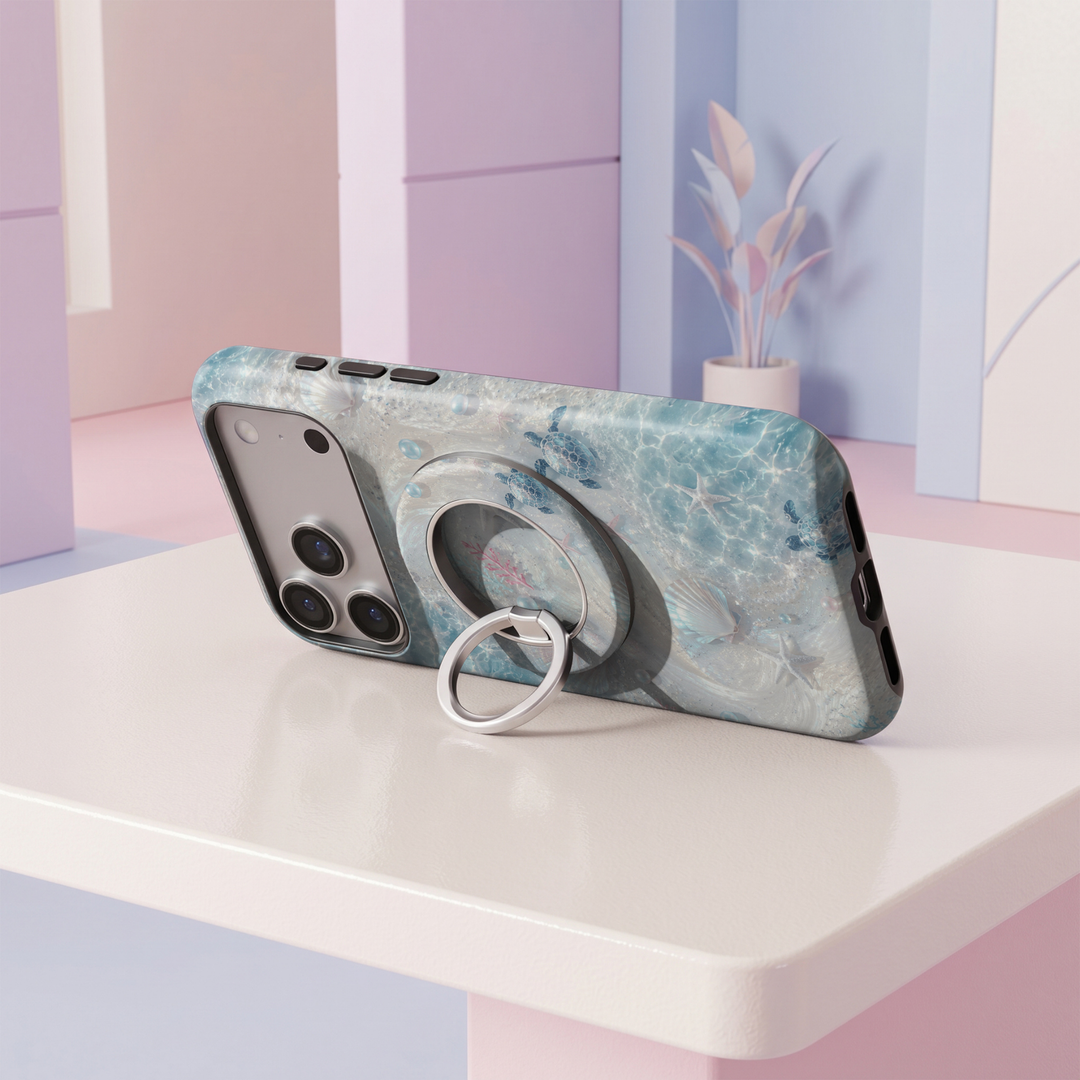 Pearl Lagoon MagSafe ring holder featuring an iridescent ocean design with seashells, pearls, starfish and blue sea turtles with a silver magnetic phone grip.