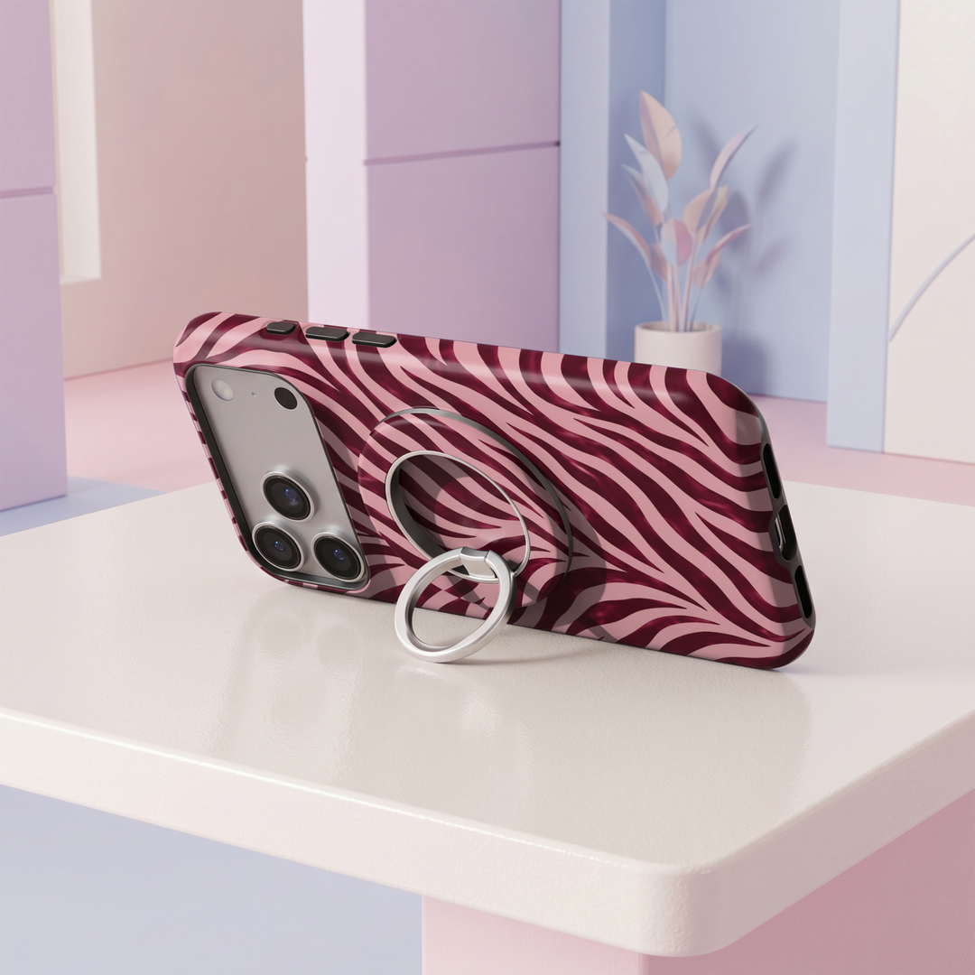 Burgundy wine and blush pink zebra print MagSafe ring holder with a bold wavy animal pattern and sleek silver magnetic phone grip and stand.