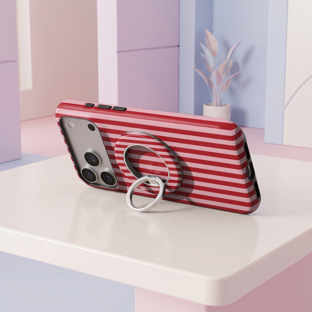 Red and pink striped MagSafe ring holder with a silver magnetic phone grip and stand.